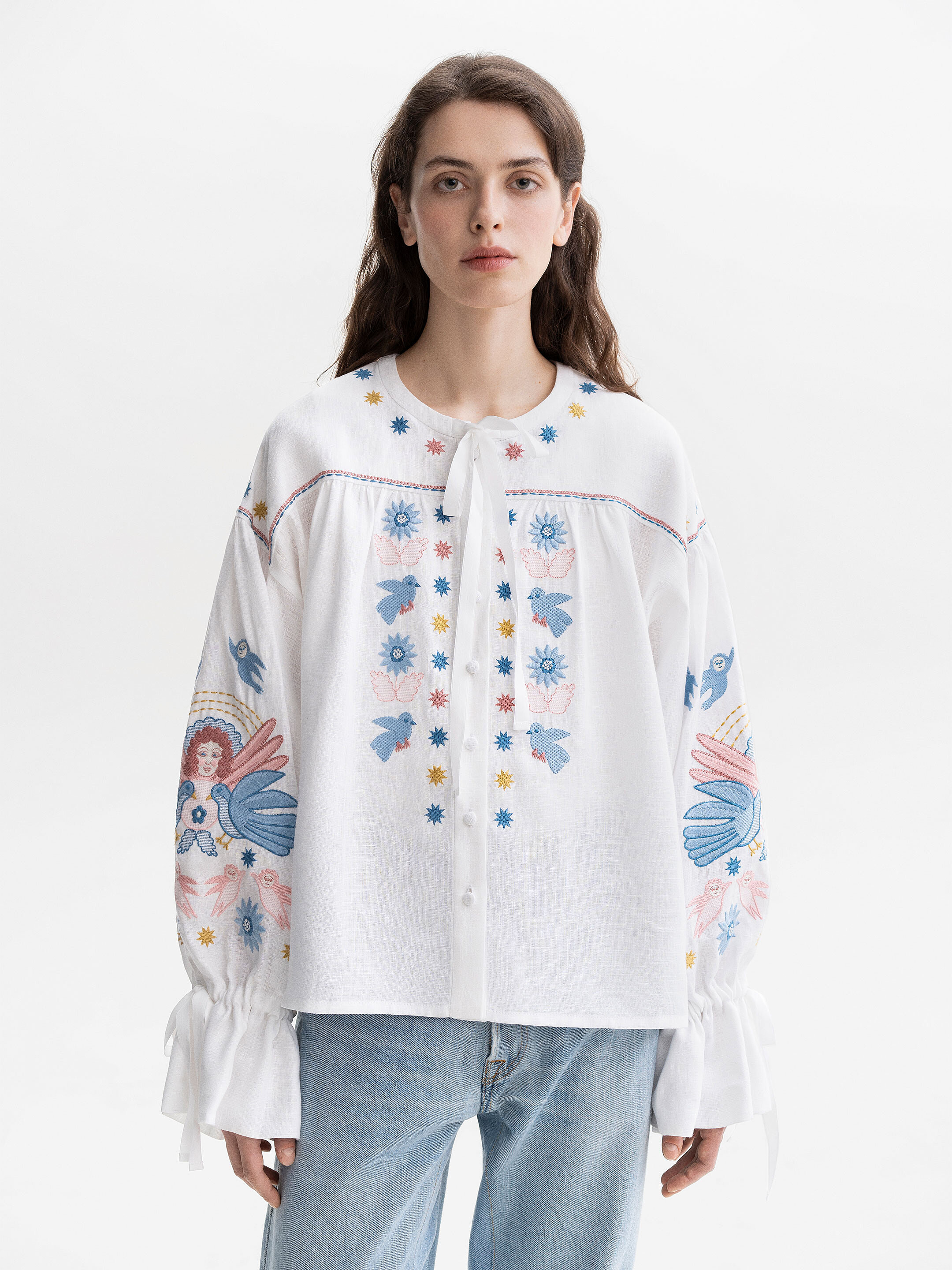 White embroidered shirt with abundant embroidery Prychornomorya photo