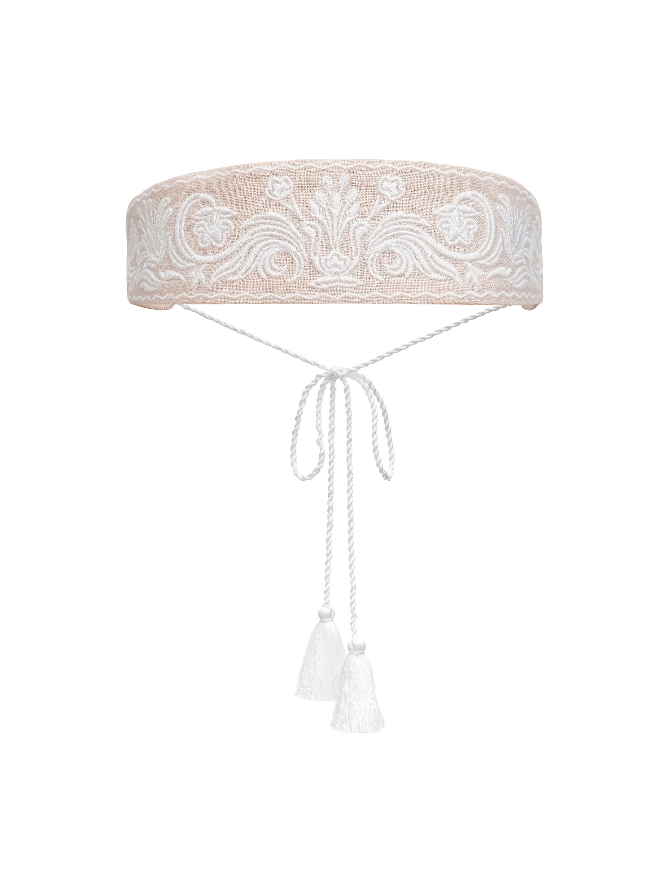 A peach-colored cap with white embroidery Kamiana Vyshyvanka in Ukraine